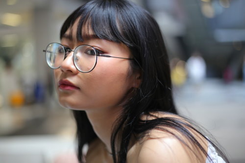 Portrait of an Asian woman with glasses