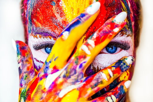 Portrait of a woman splashed with paint