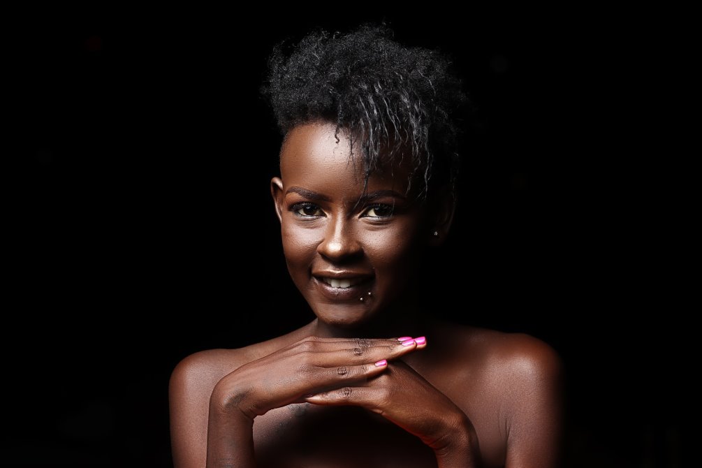 Woman in front of black background